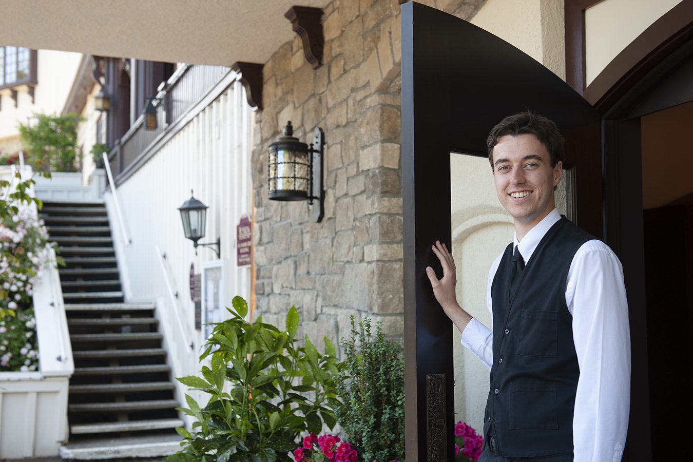 banner image is of Guest attendant opens the lobby door