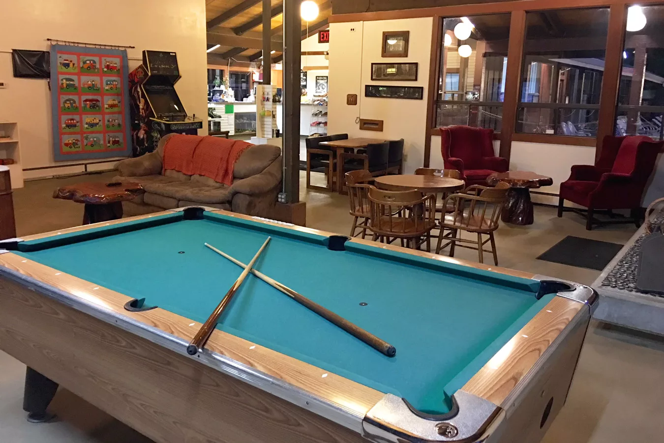 banner image is of KOA Game Room pool table and arcade | Benbow Historic Inn
