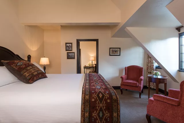 banner image is of Hotel bedroom with sofas at Benbow Historic Inn