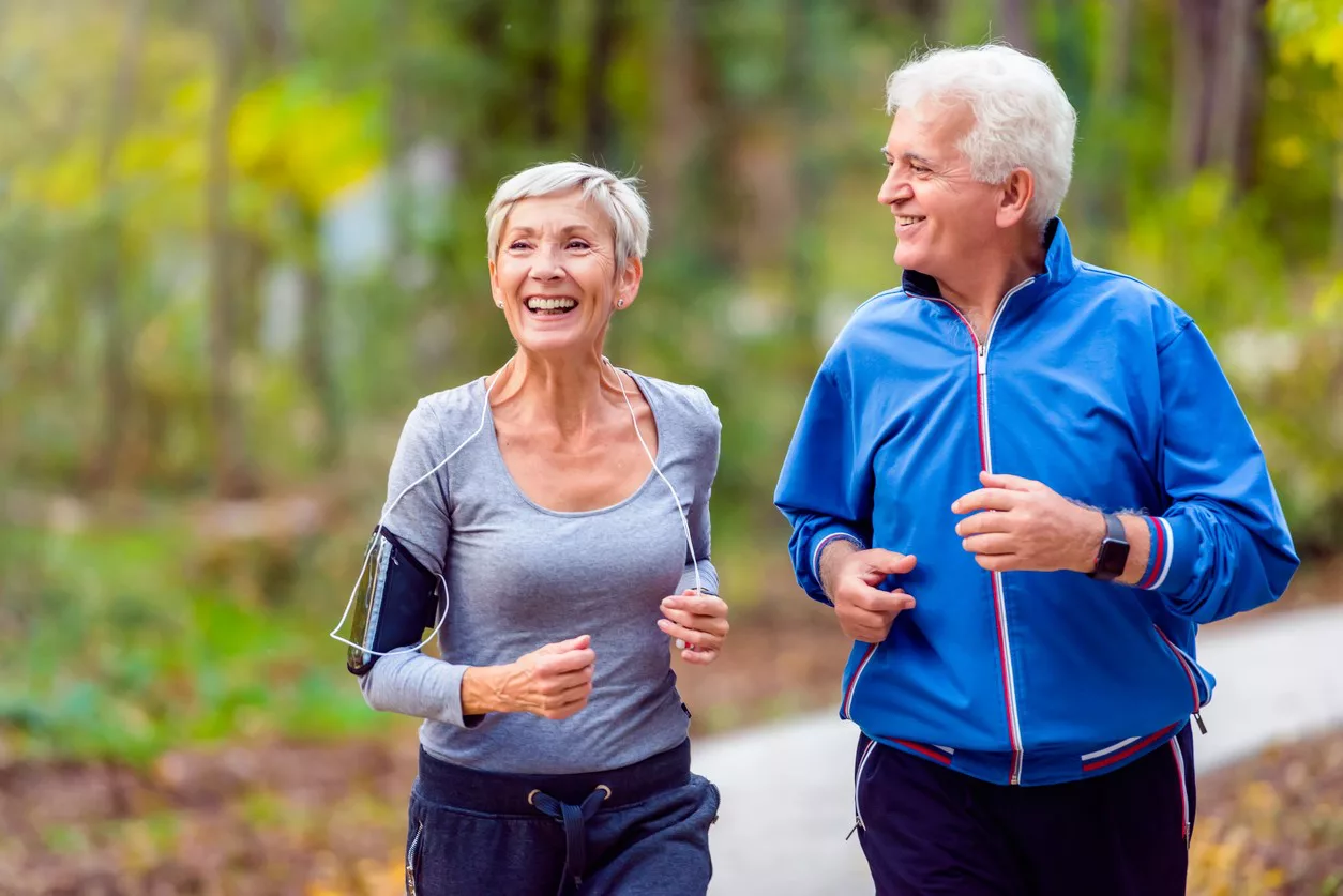 banner image is of Older male and female jogging outdoors